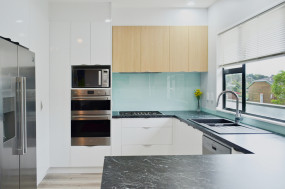 White kitchen with wood feature doors