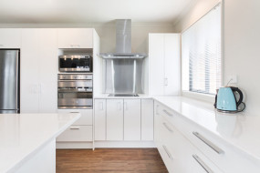 White Kitchen and Benchtop with Stainless Steel appliances