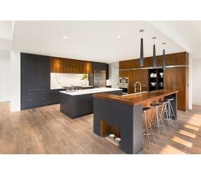Open-plan kitchen with wood and black door and drawer styles