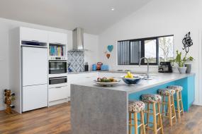 White kitchen with light blue barback