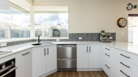 bright kitchen renovation christchurch white cabinets blue tile backsplash
