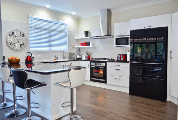 white kitchen black benchtop