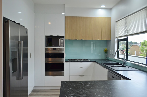 white kitchen feature wooden doors