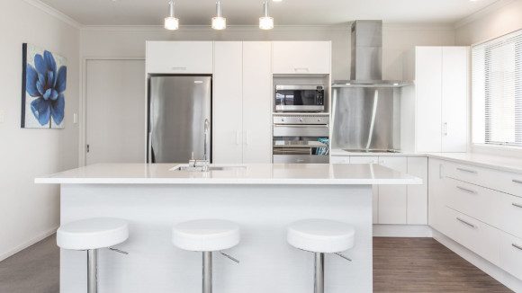 sleek kitchen renovation christchurch white cabinets stainless steel appliances